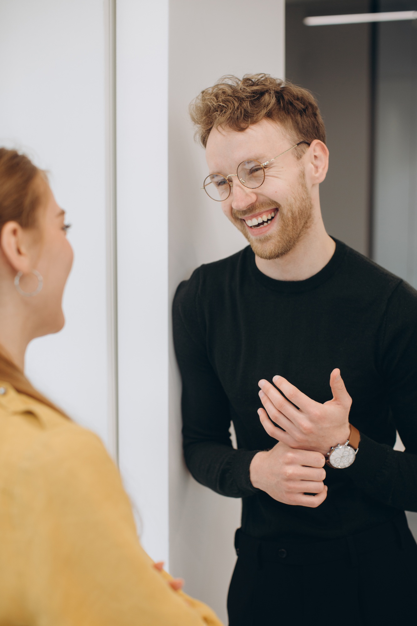 Smiling businessman discussing with businesswoman